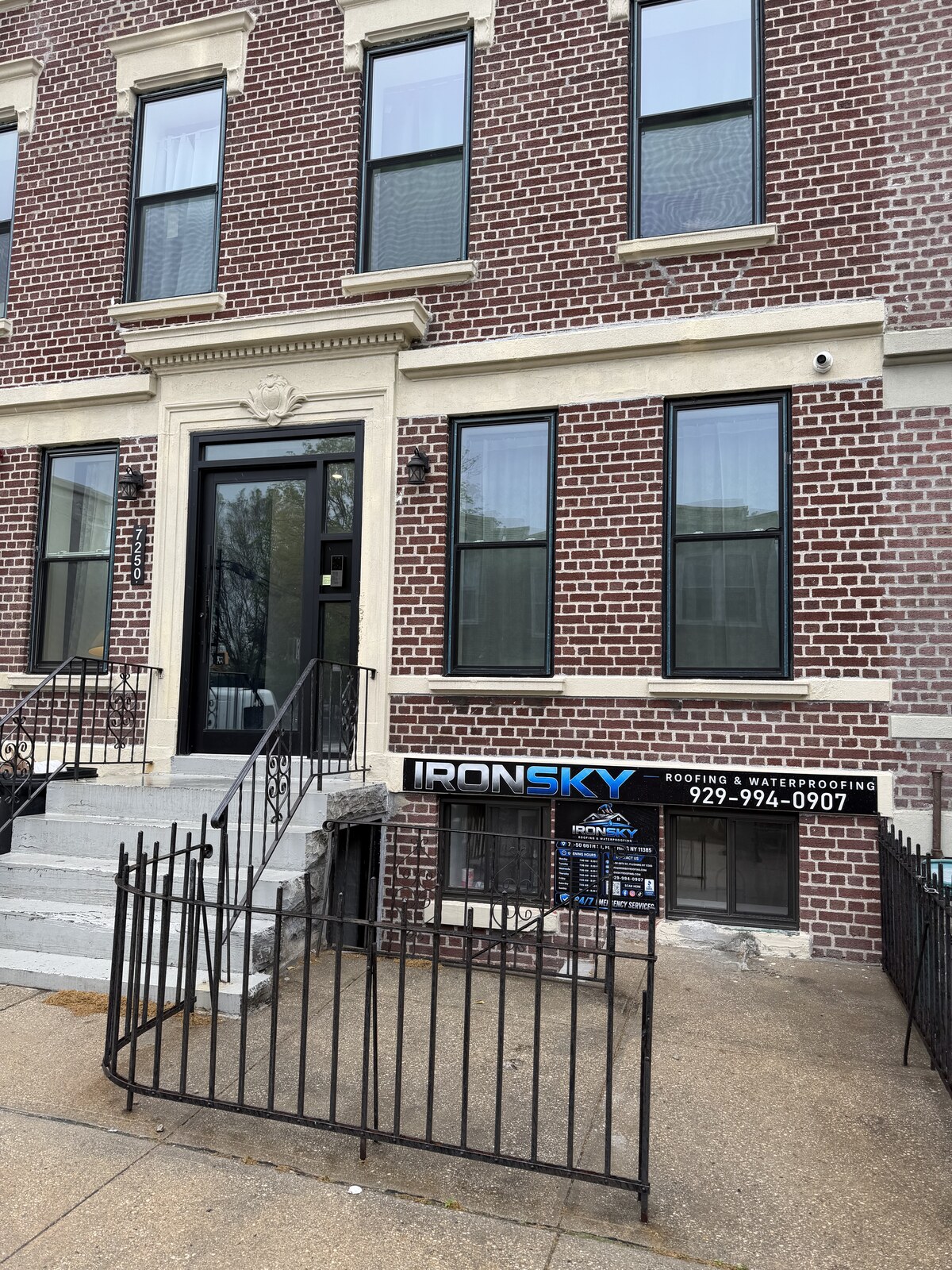 IronSky Roofing & Waterproofing brick storefront in Flushing, Queens, NYC